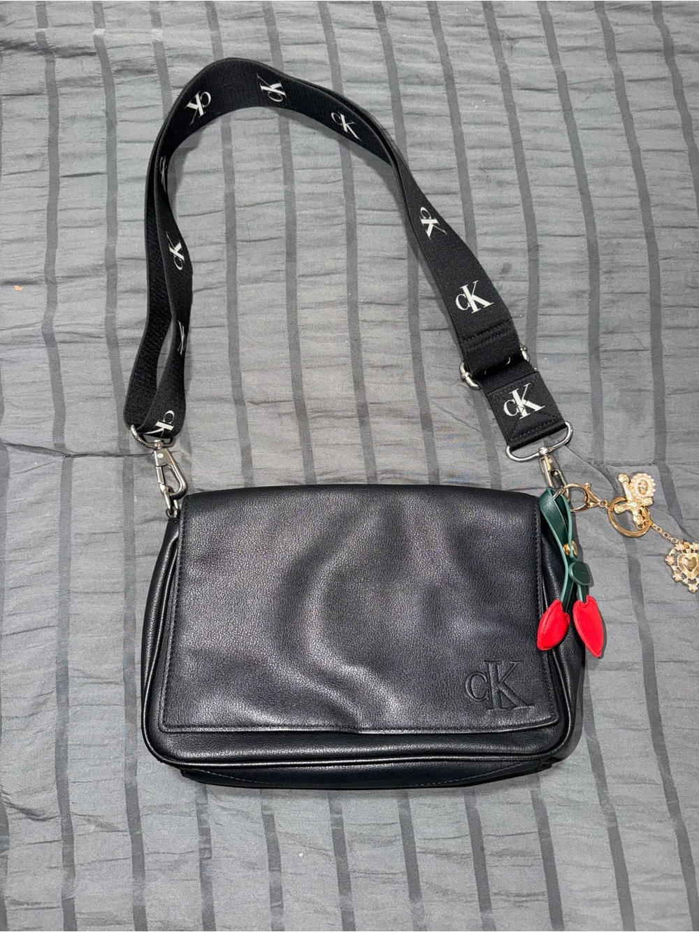 Calvin Klein Black Crossbody Bag with Red Charm Accent